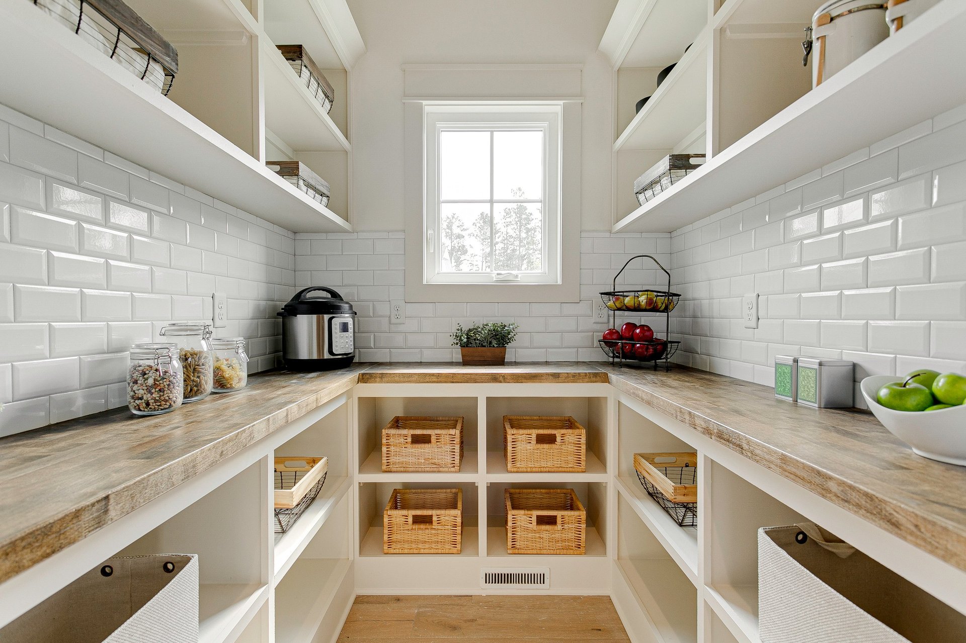 Beautifully organized pantry with wooden shelves and storage baskets